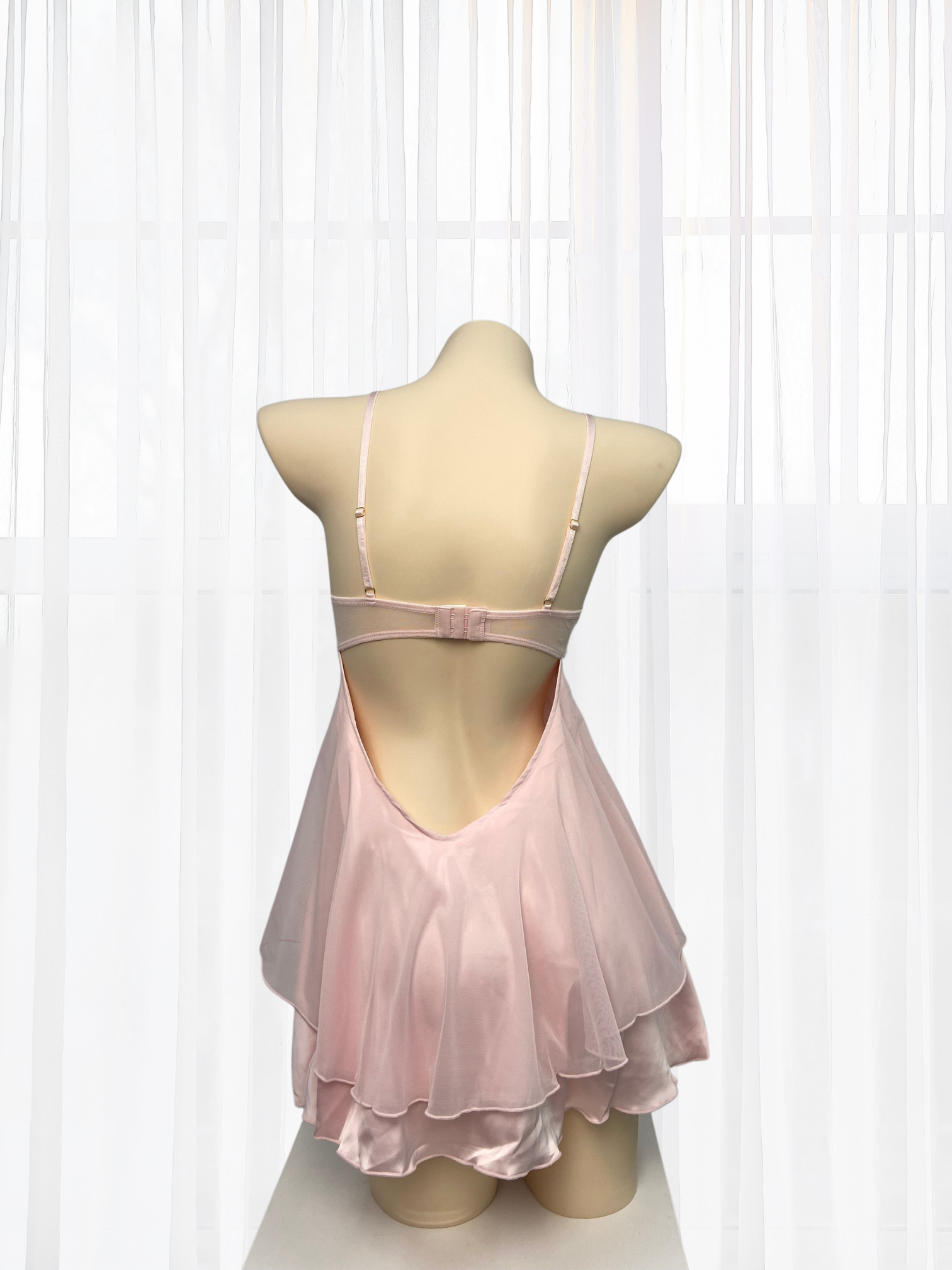 Wonder 18 Evelyn Babydoll features soft padding and double layer skirting with flowy satin dress.