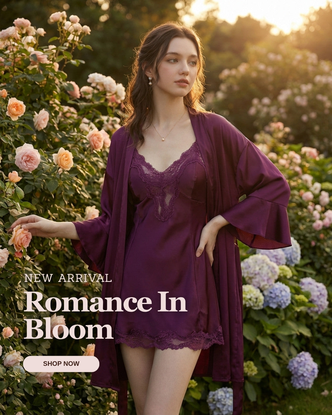 Woman in a purple lingerie set with a robe standing in a garden with flowers.