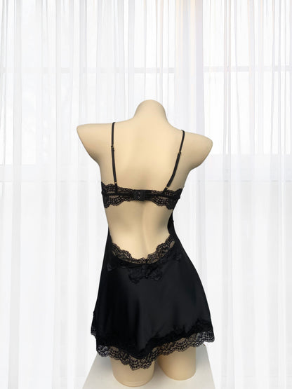 Black lace lingerie set on a mannequin against a white background